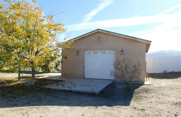 a view of a livingroom with a fireplace and a chandelier