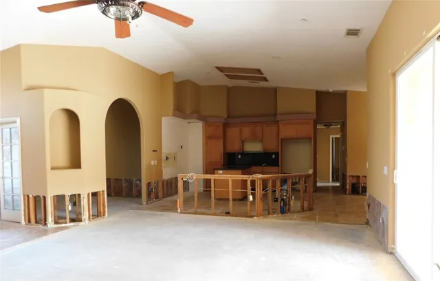 a view of a kitchen with a sink and cabinets