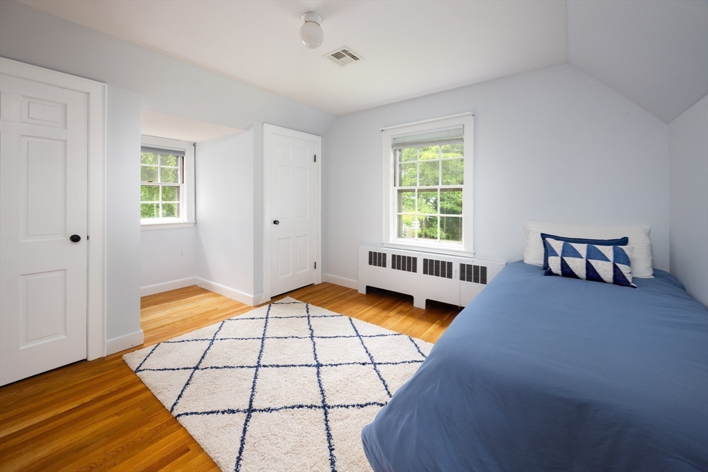 7 Southwick Circle Wellesley, MA 02481 - Photo 15 of 17 a bedroom with a bed and a window