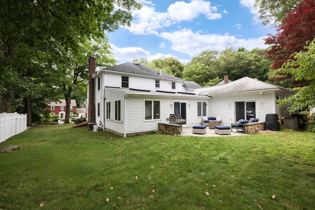 7 Southwick Circle Wellesley, MA 02481 - Photo 17 of 17 a view of a house with a yard and sitting area