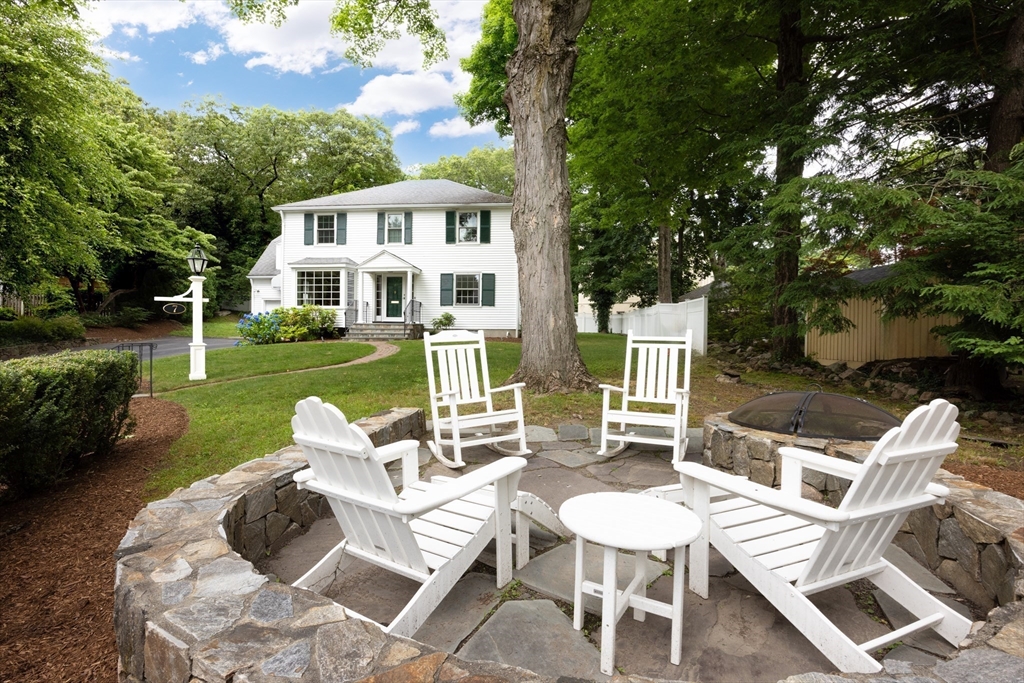 7 Southwick Circle Wellesley, MA 02481 - Photo 2 of 17 a view of a patio with couches chairs and a yard