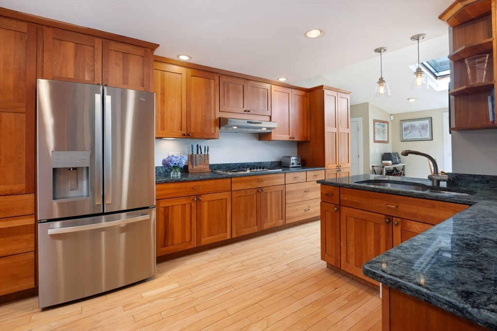 7 Southwick Circle Wellesley, MA 02481 - Photo 5 of 17 a kitchen with stainless steel appliances granite countertop a refrigerator a sink dishwasher a stove with large countertops and cabinets