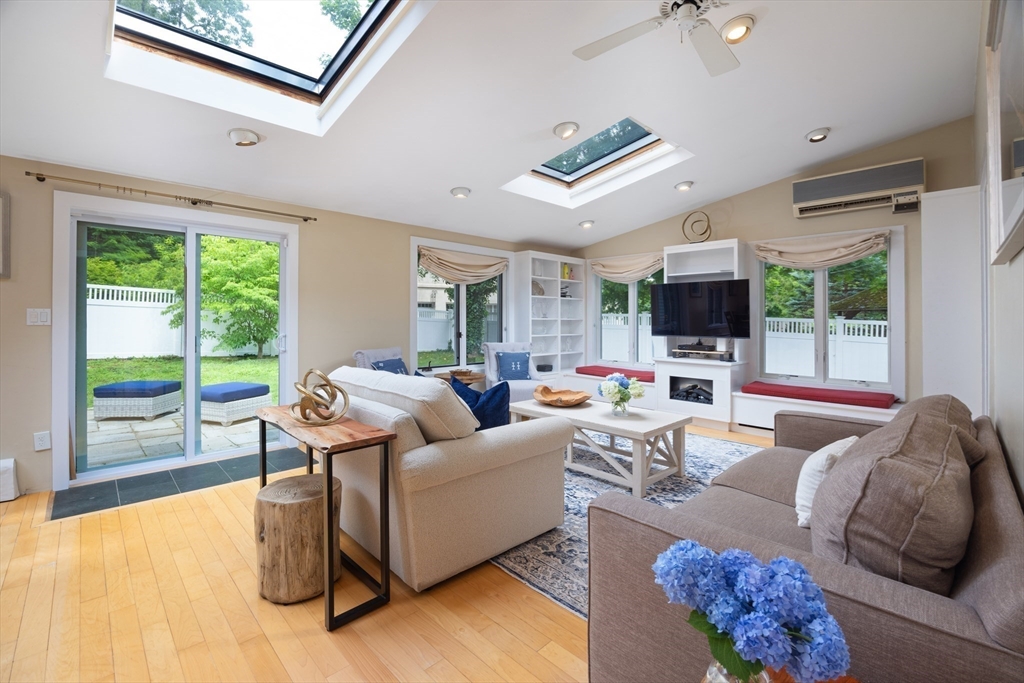 7 Southwick Circle Wellesley, MA 02481 - Photo 8 of 17 a living room with furniture fireplace and a large window