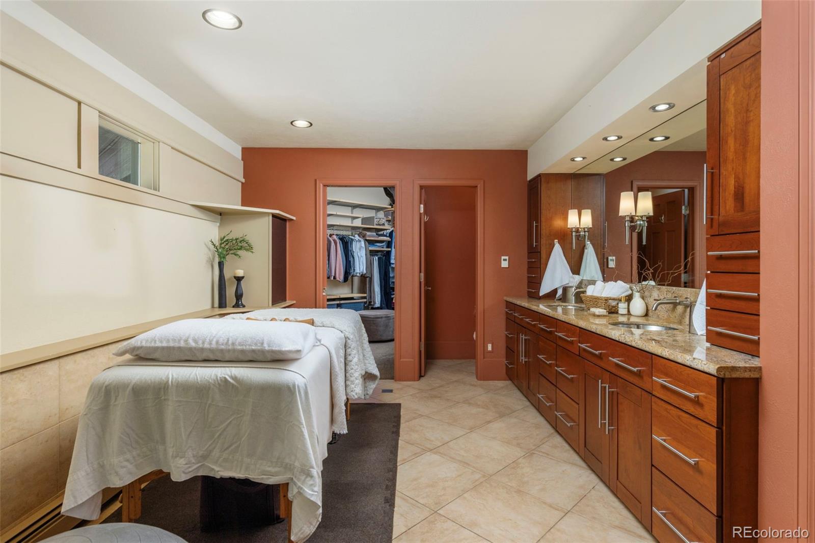 1323 South Snyder Gulch Road Evergreen, CO 80439 - Photo 20 of 47 a bedroom with a bed and a dresser