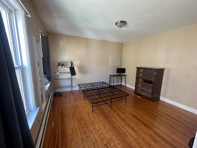 a view of a livingroom with wooden floor