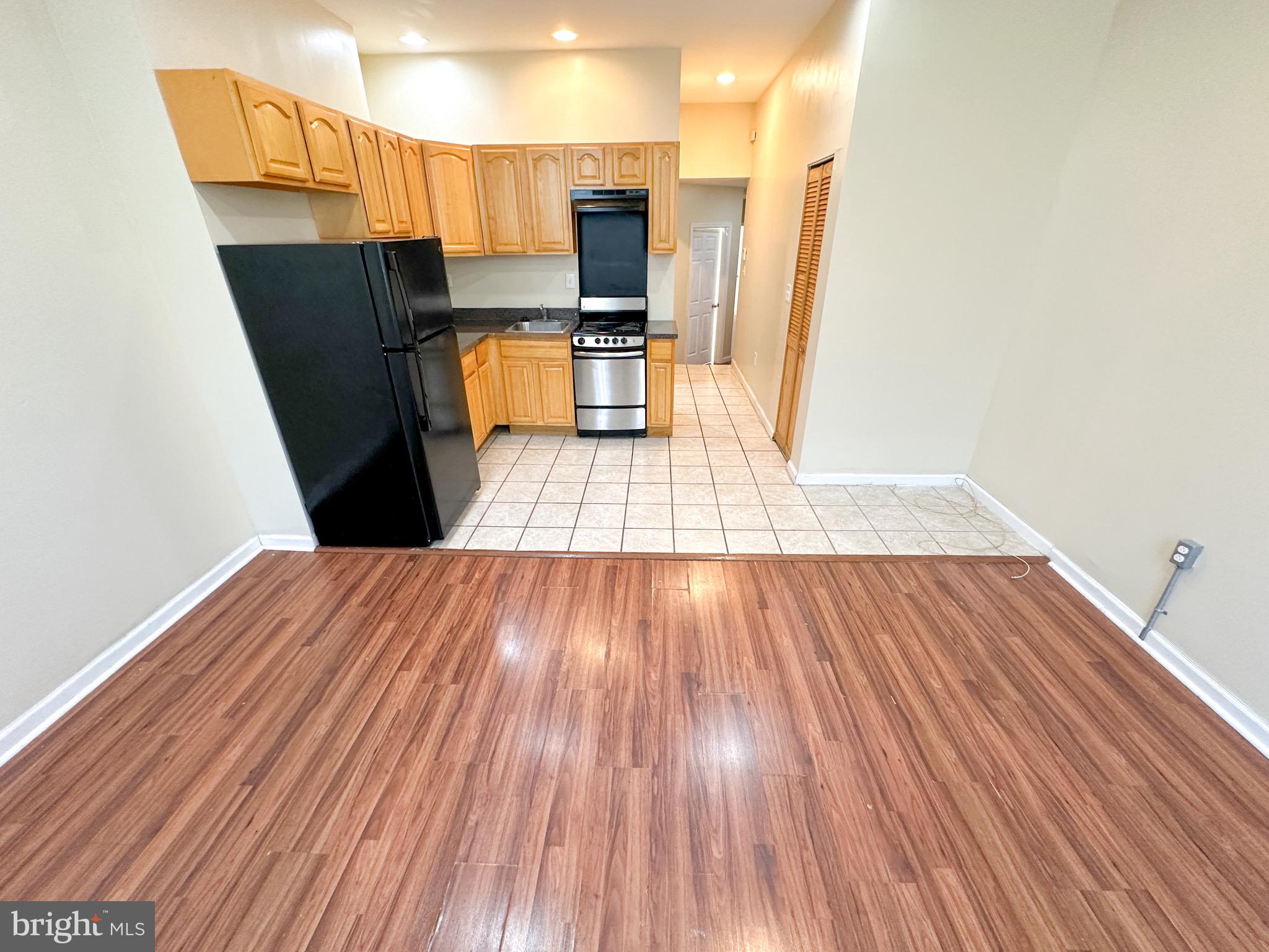 3042 North 15th Street, Unit 2 Philadelphia, PA 19132 - Photo 2 of 10 a view of kitchen with sink and refrigerator