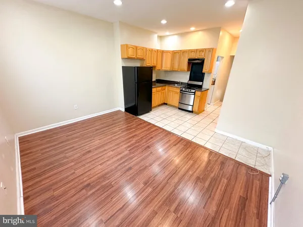 a view of kitchen and wooden floor