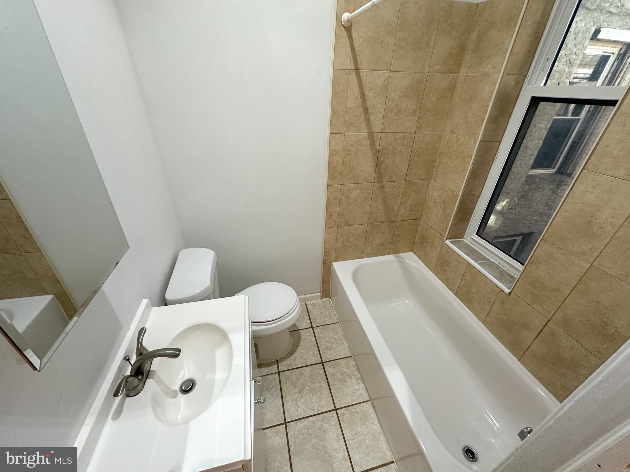 3042 North 15th Street, Unit 2 Philadelphia, PA 19132 - Photo 5 of 10 a bathroom with a sink and toilet