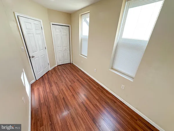a view of front door with wooden floor
