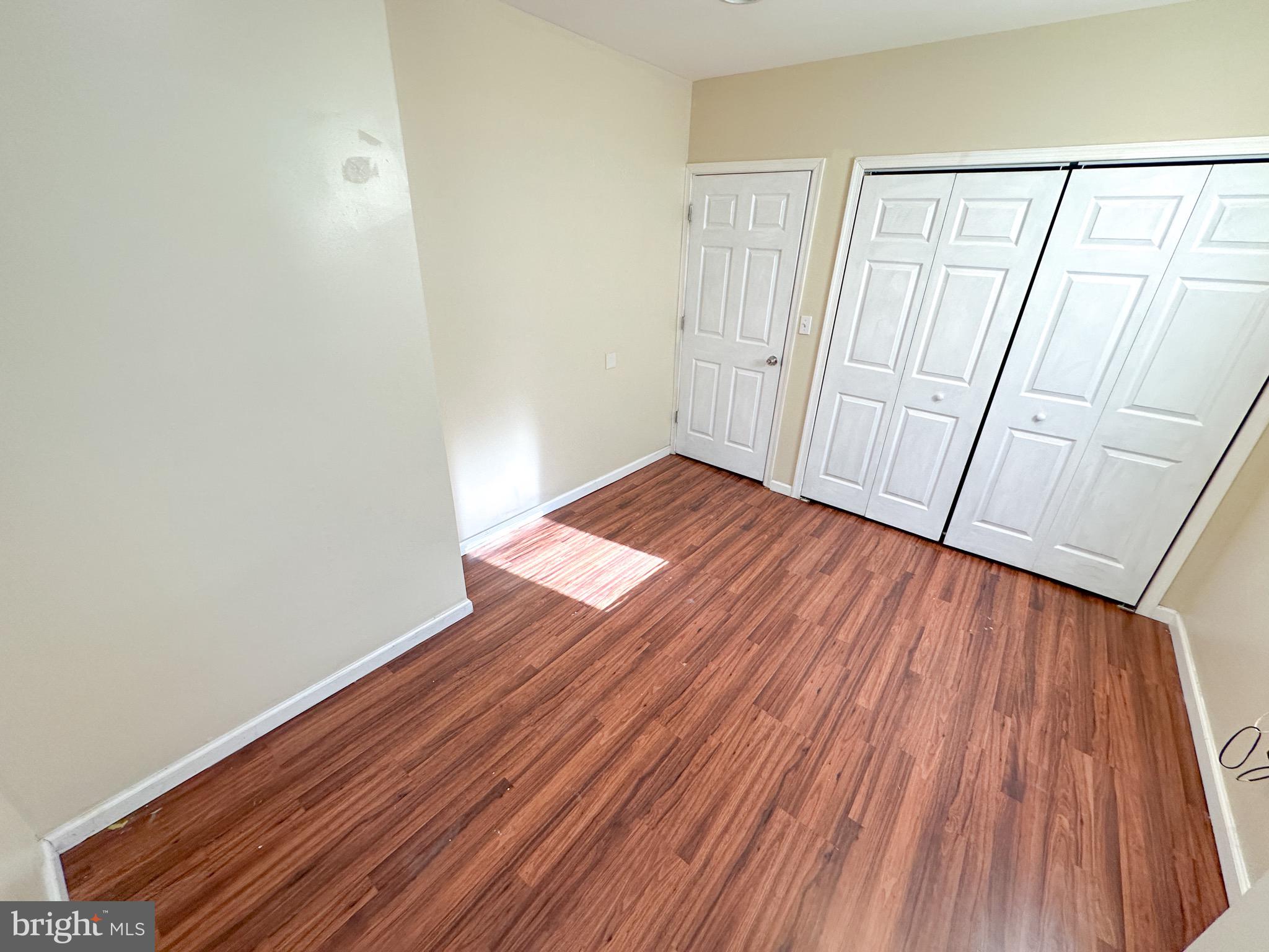 3042 North 15th Street, Unit 2 Philadelphia, PA 19132 - Photo 10 of 10 a view of an empty room with wooden floor