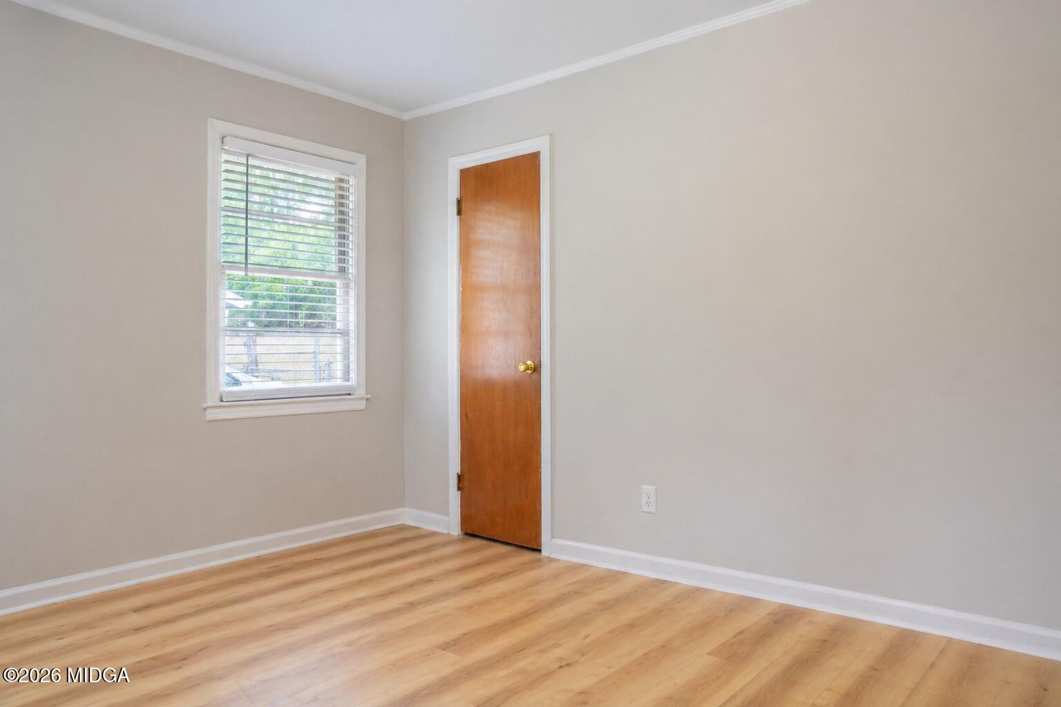 3319 Mohawk Road Macon, GA 31217 - Photo 26 of 38 a view of an empty room with wooden floor and a window