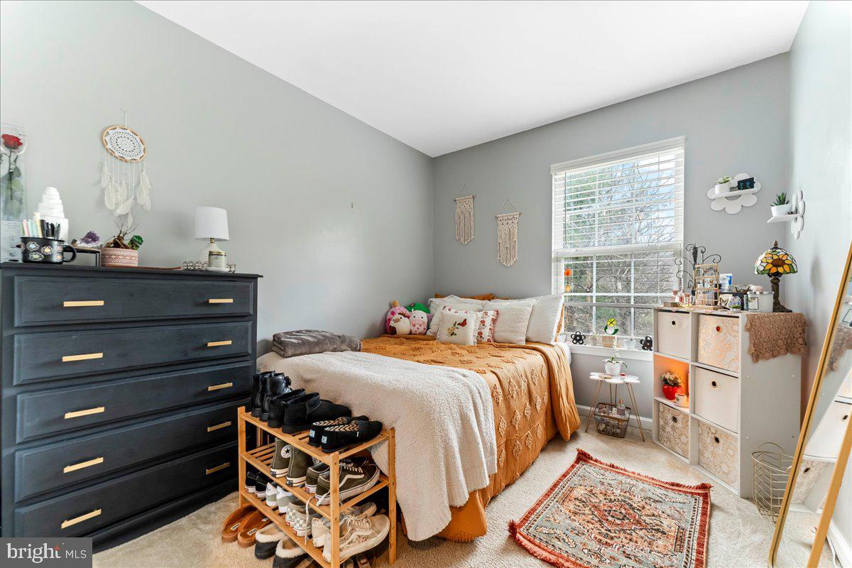 6 Marc Drive Coatesville, PA 19320 - Photo 13 of 25 a bedroom with a bed and wooden floor