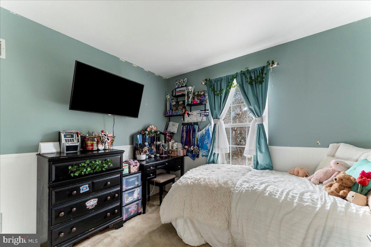 6 Marc Drive Coatesville, PA 19320 - Photo 16 of 25 a bedroom with a bed and a flat screen tv