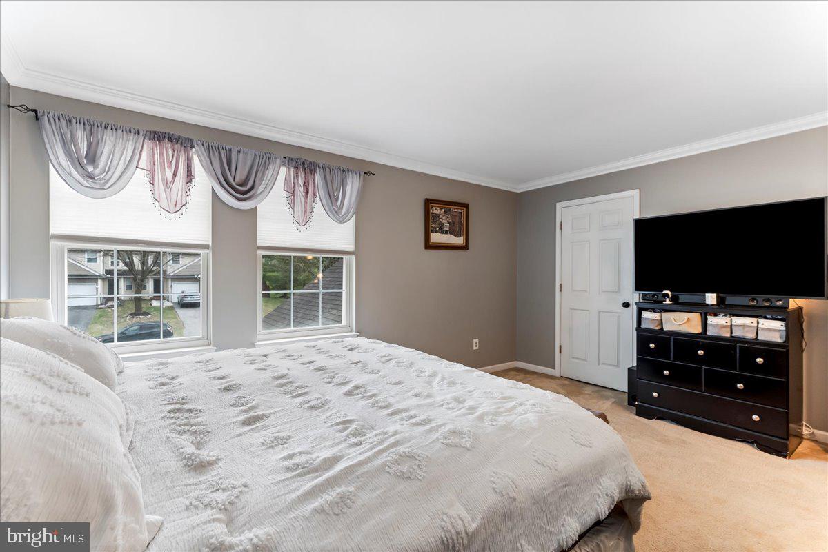 6 Marc Drive Coatesville, PA 19320 - Photo 19 of 25 a bedroom with a bed and a flat screen tv