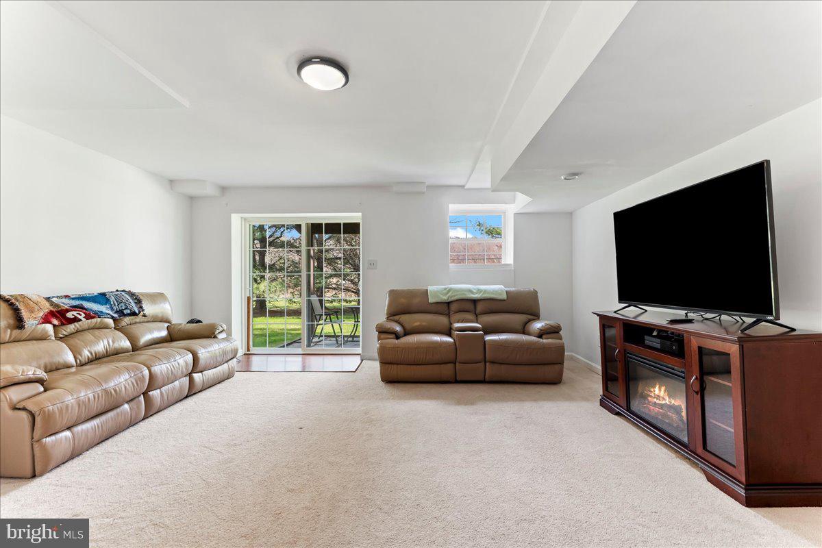 6 Marc Drive Coatesville, PA 19320 - Photo 22 of 25 a living room with furniture and a flat screen tv