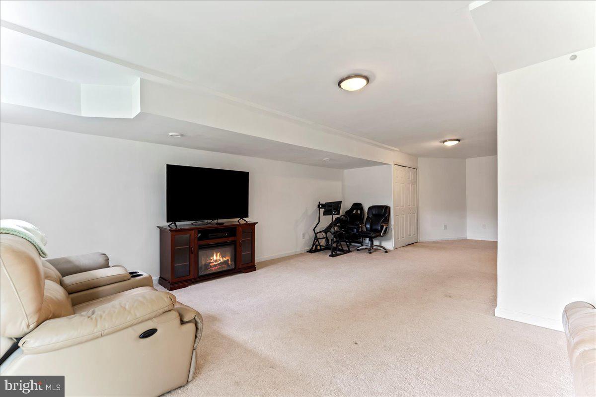 6 Marc Drive Coatesville, PA 19320 - Photo 23 of 25 a living room with furniture and a flat screen tv