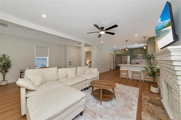 a living room with furniture and a fireplace