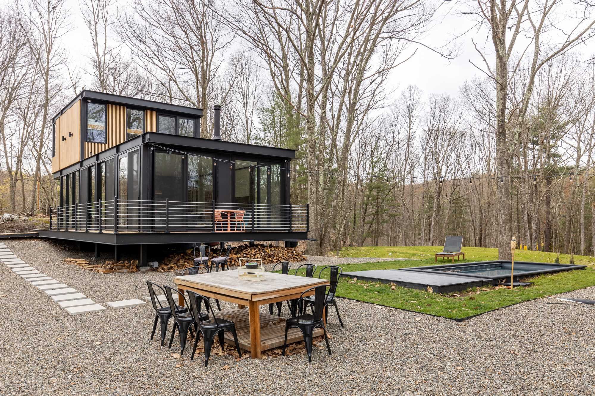 283 Willow Glen Road Milan, NY 12571 - Photo 23 of 23 a backyard of a house with barbeque oven table and chairs