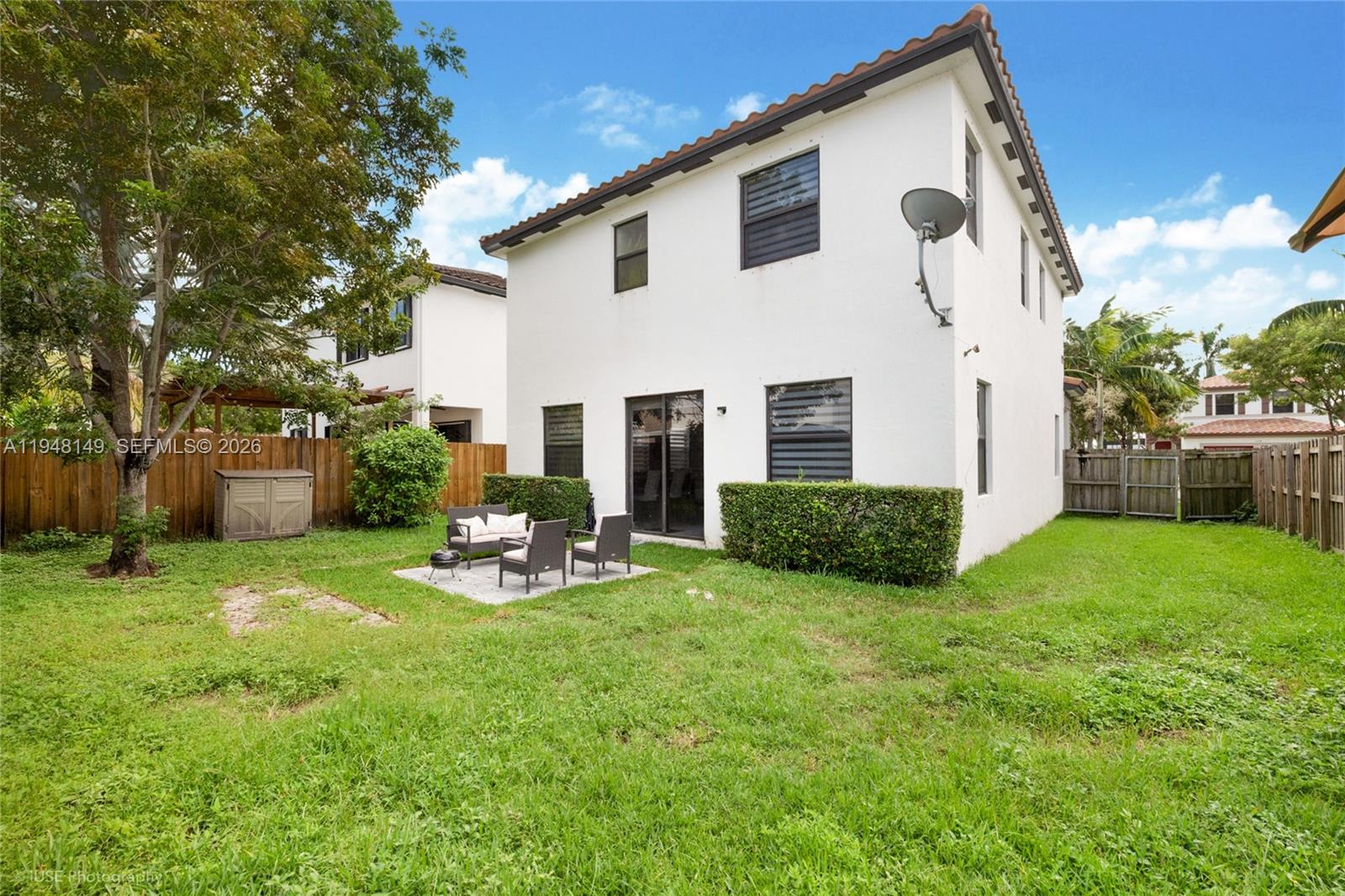11711 Southwest 254th Street Homestead, FL 33032 - Photo 16 of 17 a backyard of a house with seating space