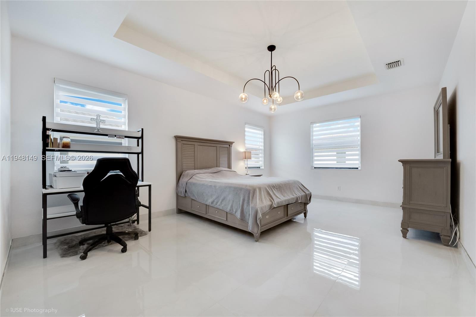 11711 Southwest 254th Street Homestead, FL 33032 - Photo 8 of 17 a bedroom with bed and a chair