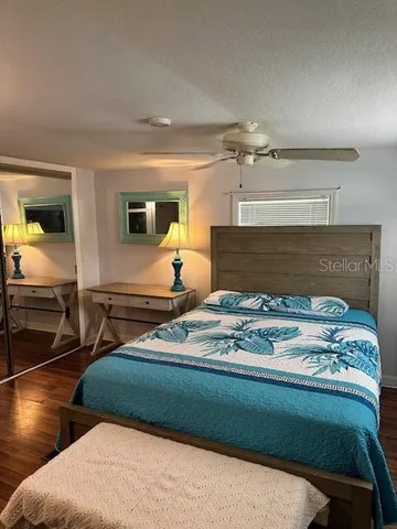 a bedroom with bed and window