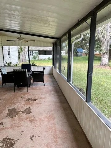 a backyard of a house with seating space