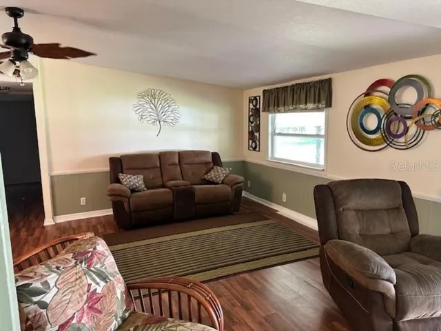 a living room with furniture and a window