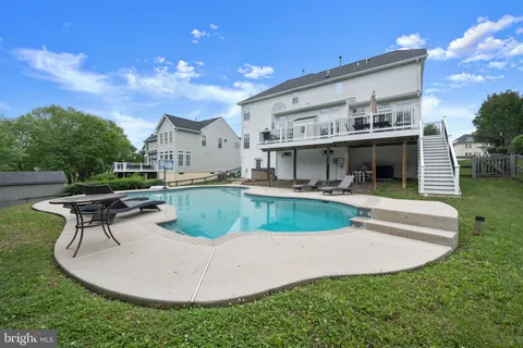 an aerial view of a house with a swimming pool