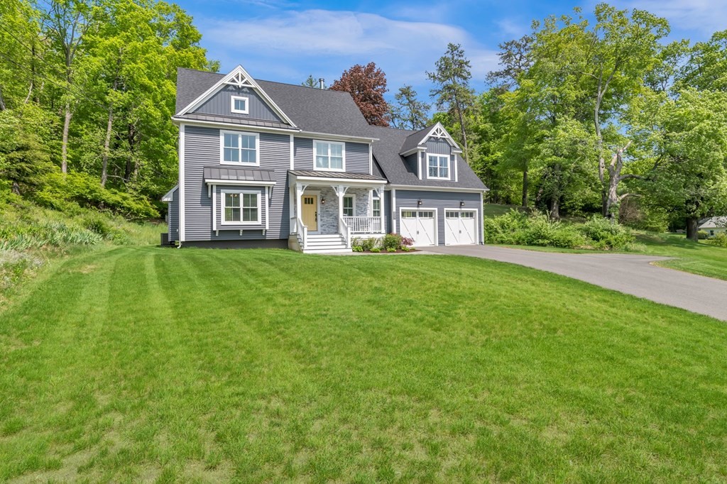 273 Scantic Road Hampden, MA 01036 - Photo 1 of 40 a front view of a house with a garden