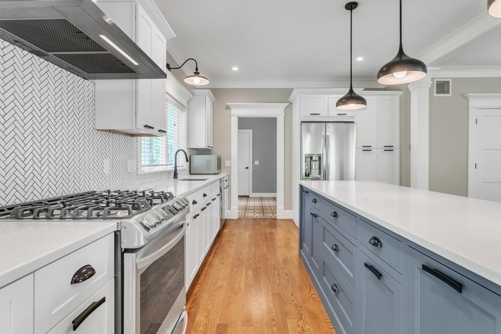 273 Scantic Road Hampden, MA 01036 - Photo 13 of 40 a large kitchen with cabinets a counter space a sink and stainless steel appliances