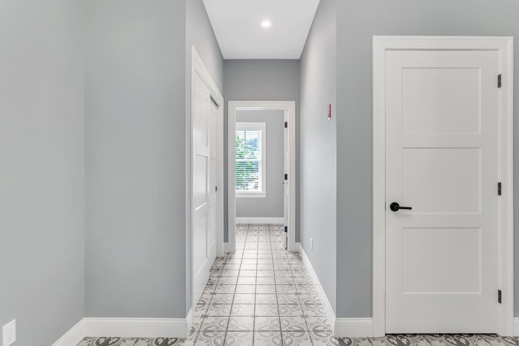 273 Scantic Road Hampden, MA 01036 - Photo 16 of 40 a view of a hallway with wooden floor and a bathroom