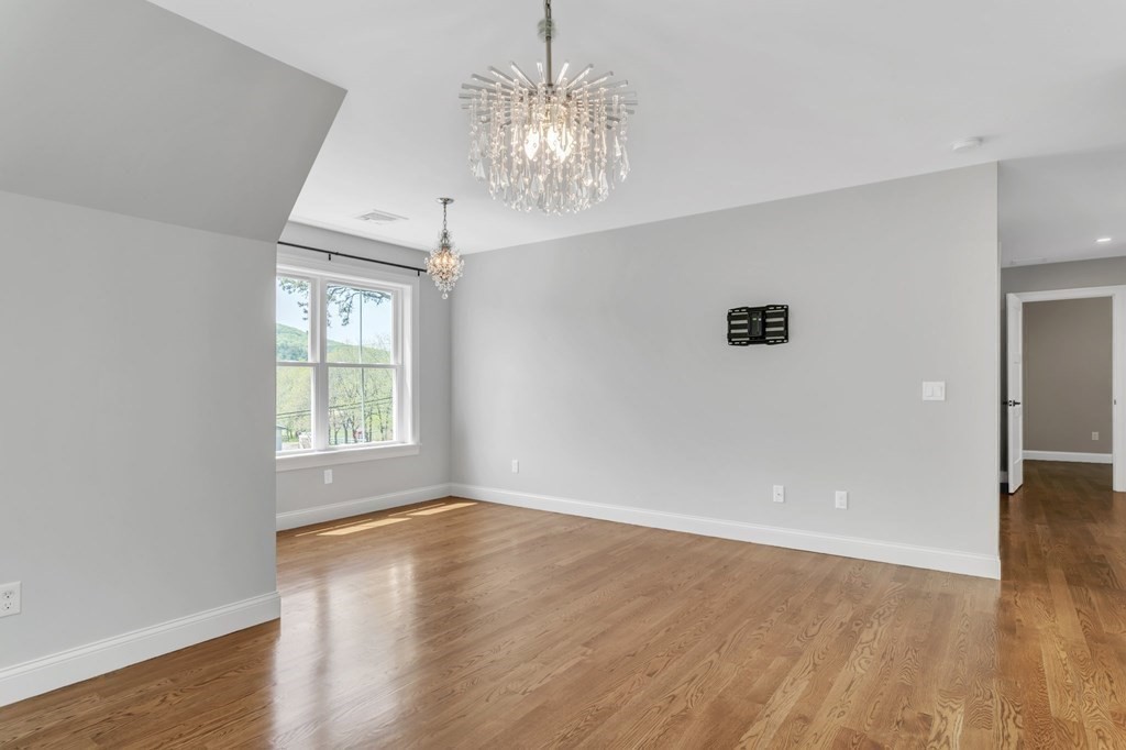 273 Scantic Road Hampden, MA 01036 - Photo 21 of 40 wooden floor in an empty room with a window