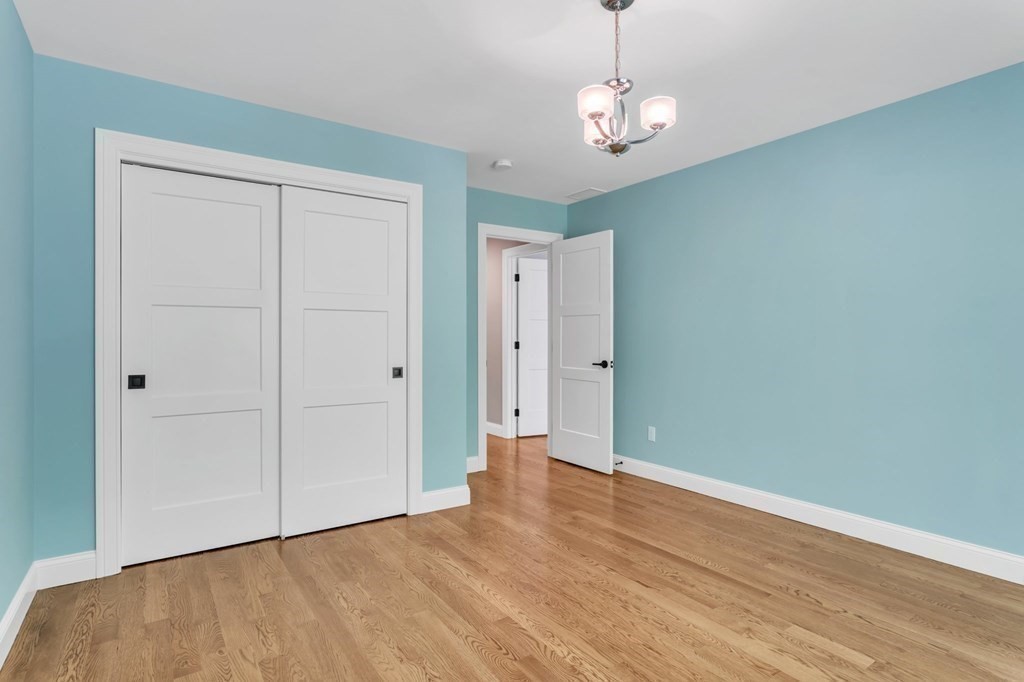273 Scantic Road Hampden, MA 01036 - Photo 28 of 40 a view of an empty room with wooden floor