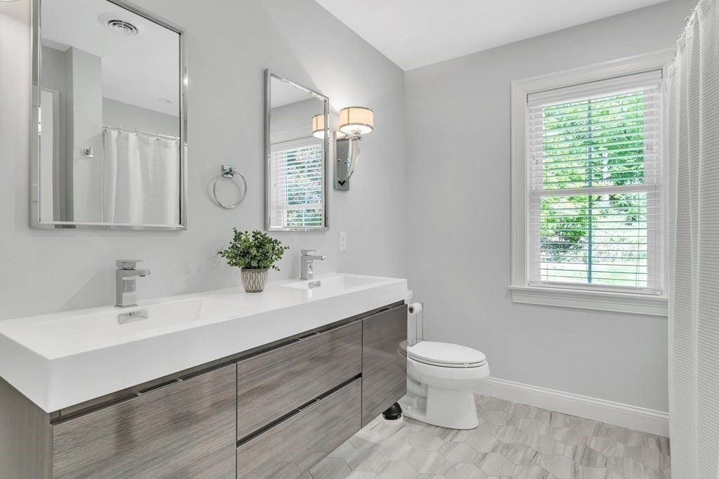 273 Scantic Road Hampden, MA 01036 - Photo 30 of 40 a bathroom with a sink toilet a mirror and shower