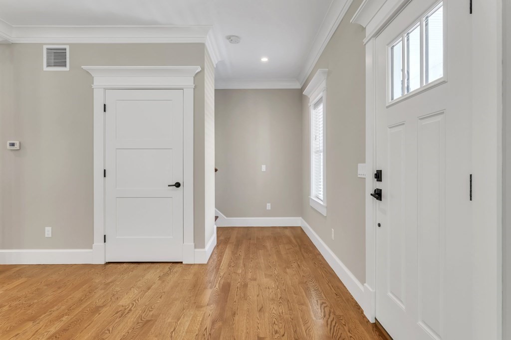273 Scantic Road Hampden, MA 01036 - Photo 3 of 40 a view of a hallway with wooden floor and a bathroom