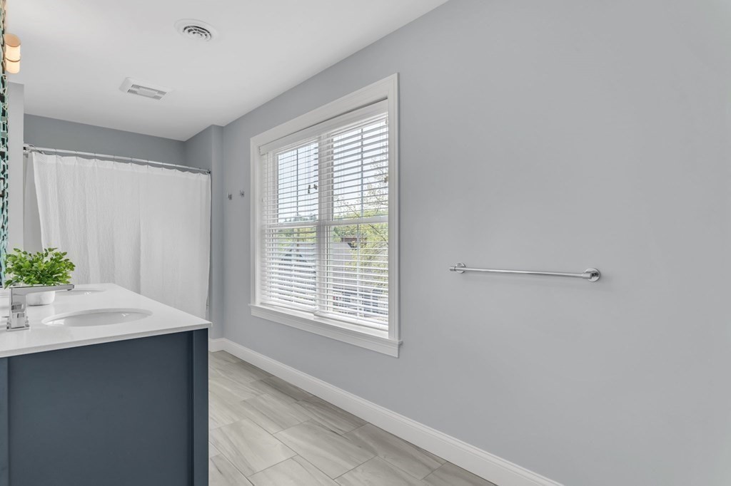 273 Scantic Road Hampden, MA 01036 - Photo 33 of 40 a room with a window and a potted plant
