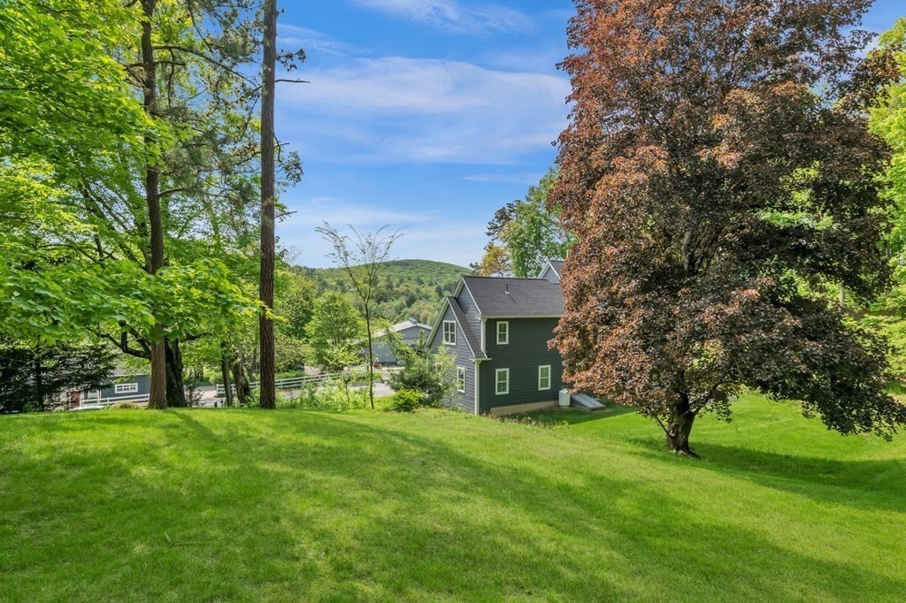 273 Scantic Road Hampden, MA 01036 - Photo 38 of 40 a view of a garden with large trees