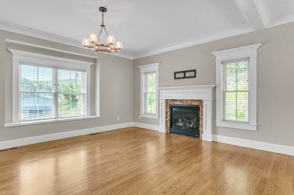 273 Scantic Road Hampden, MA 01036 - Photo 5 of 40 a view of an empty room with window and fire place