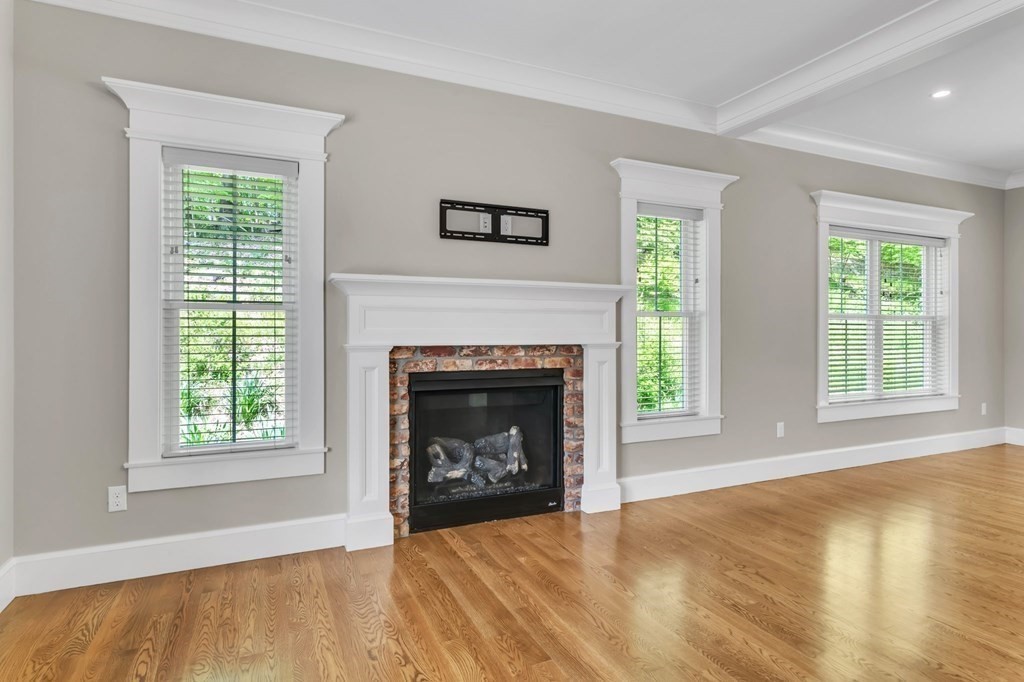 273 Scantic Road Hampden, MA 01036 - Photo 6 of 40 a view of an empty room with wooden floor and a window