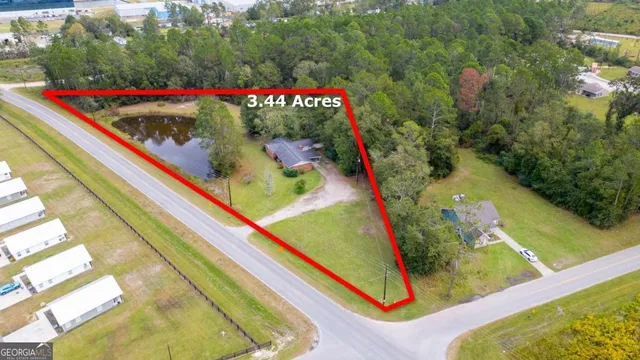 a view of a patio with table and chairs a barbeque