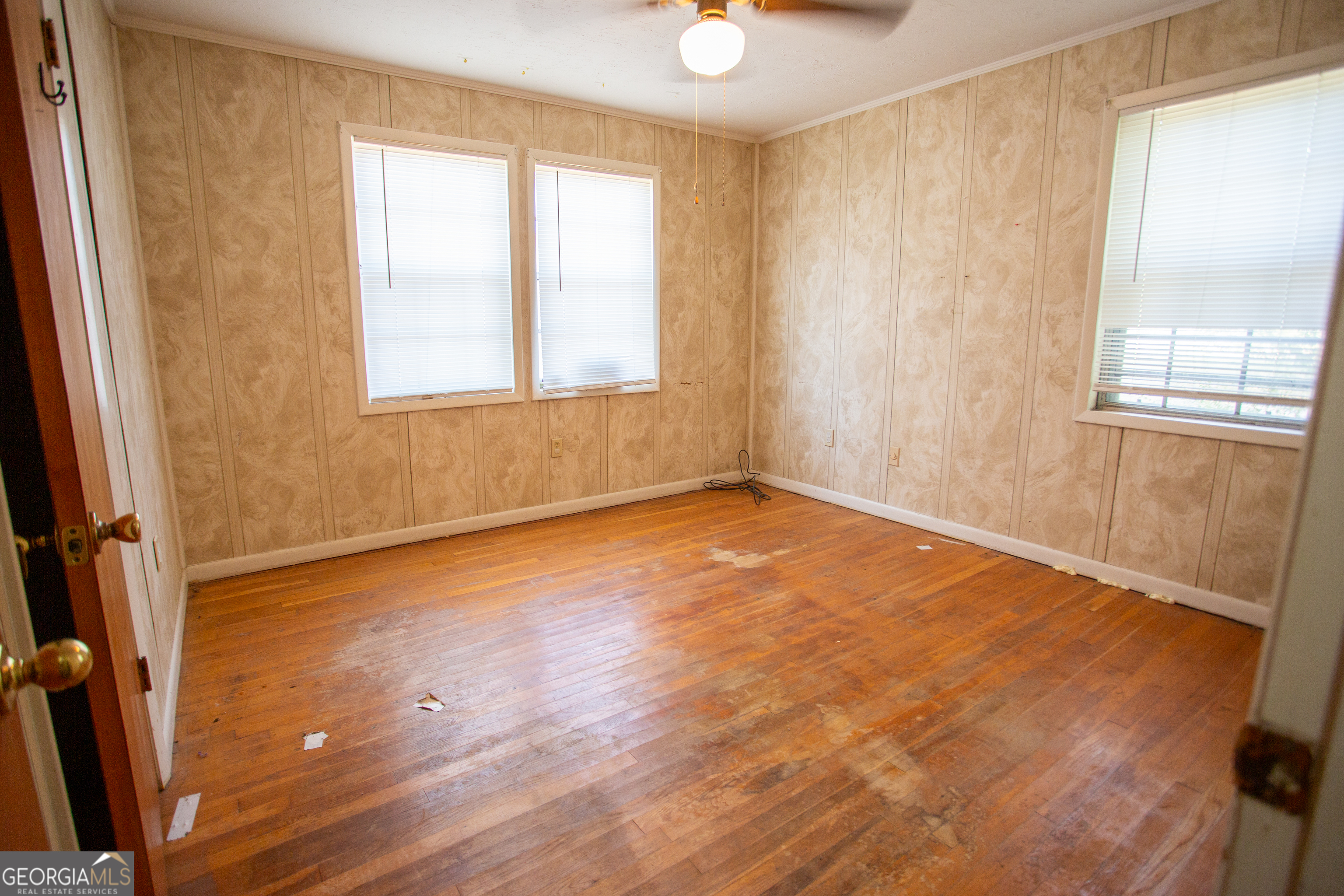 537 City Circle Road Baxley, GA 31513 - Photo 23 of 33 wooden floor and window in an empty room
