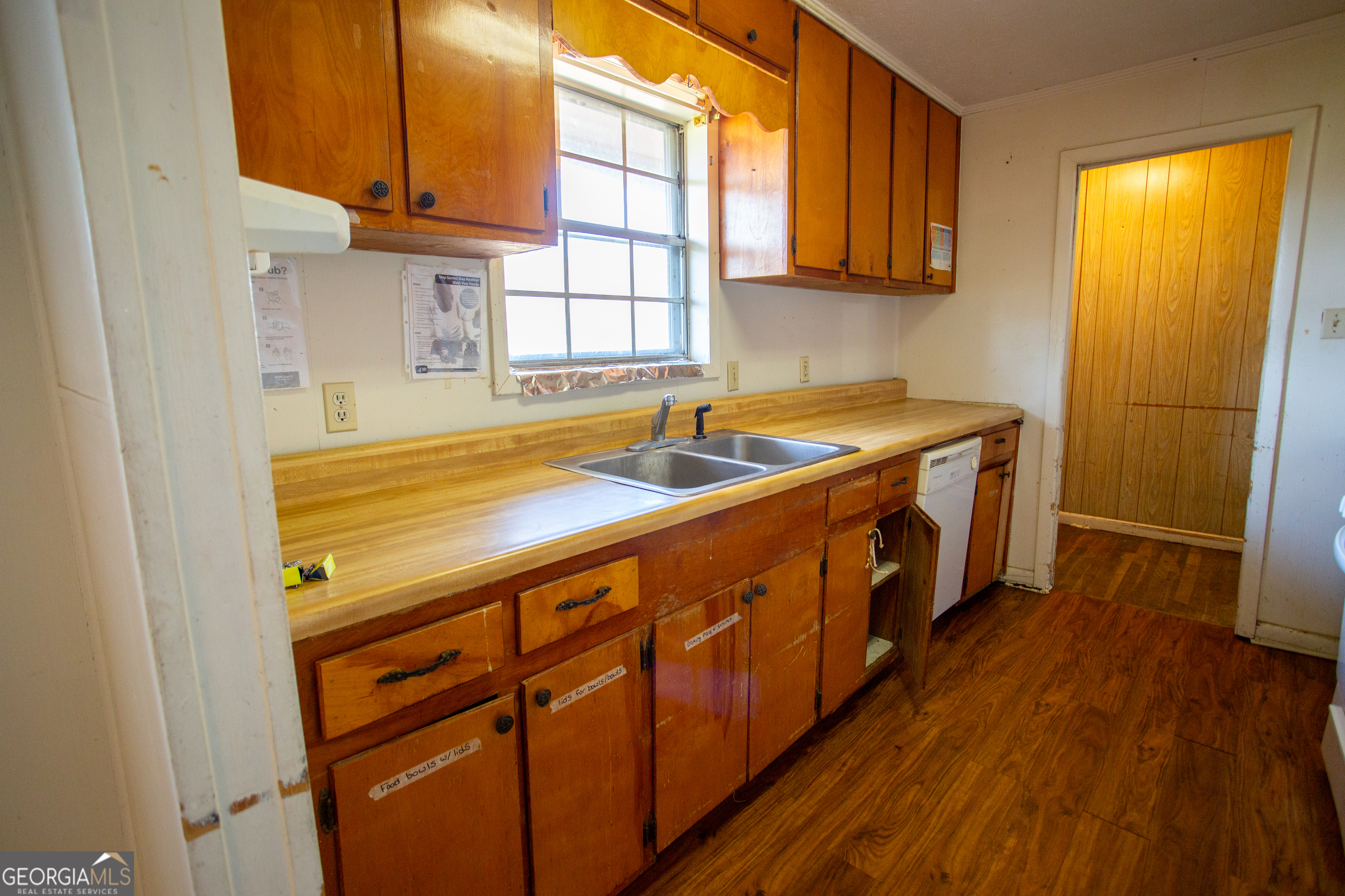 537 City Circle Road Baxley, GA 31513 - Photo 26 of 33 a kitchen with stainless steel appliances granite countertop a sink and a wooden floors