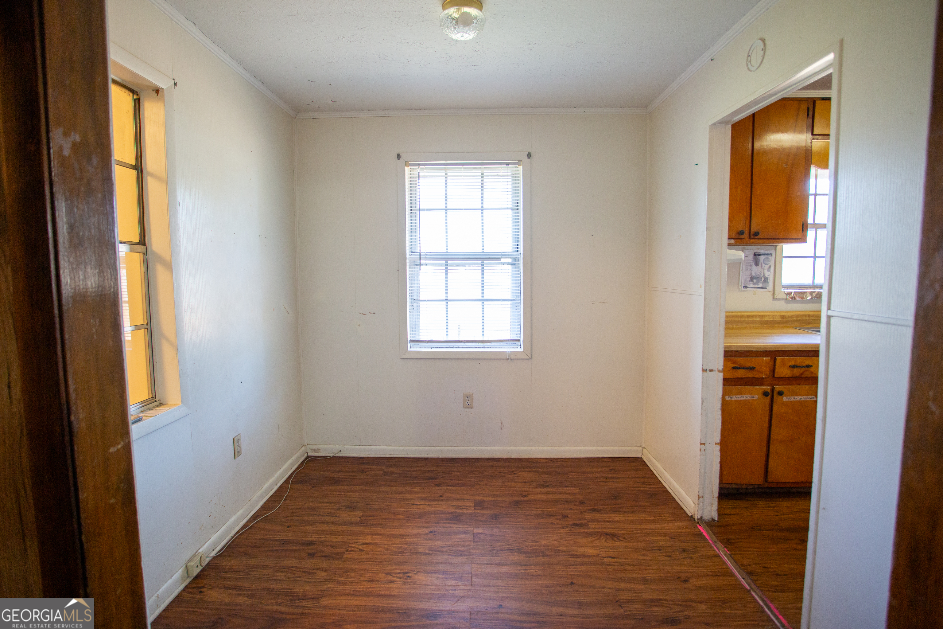 537 City Circle Road Baxley, GA 31513 - Photo 28 of 33 a view of an empty room with wooden floor and a window
