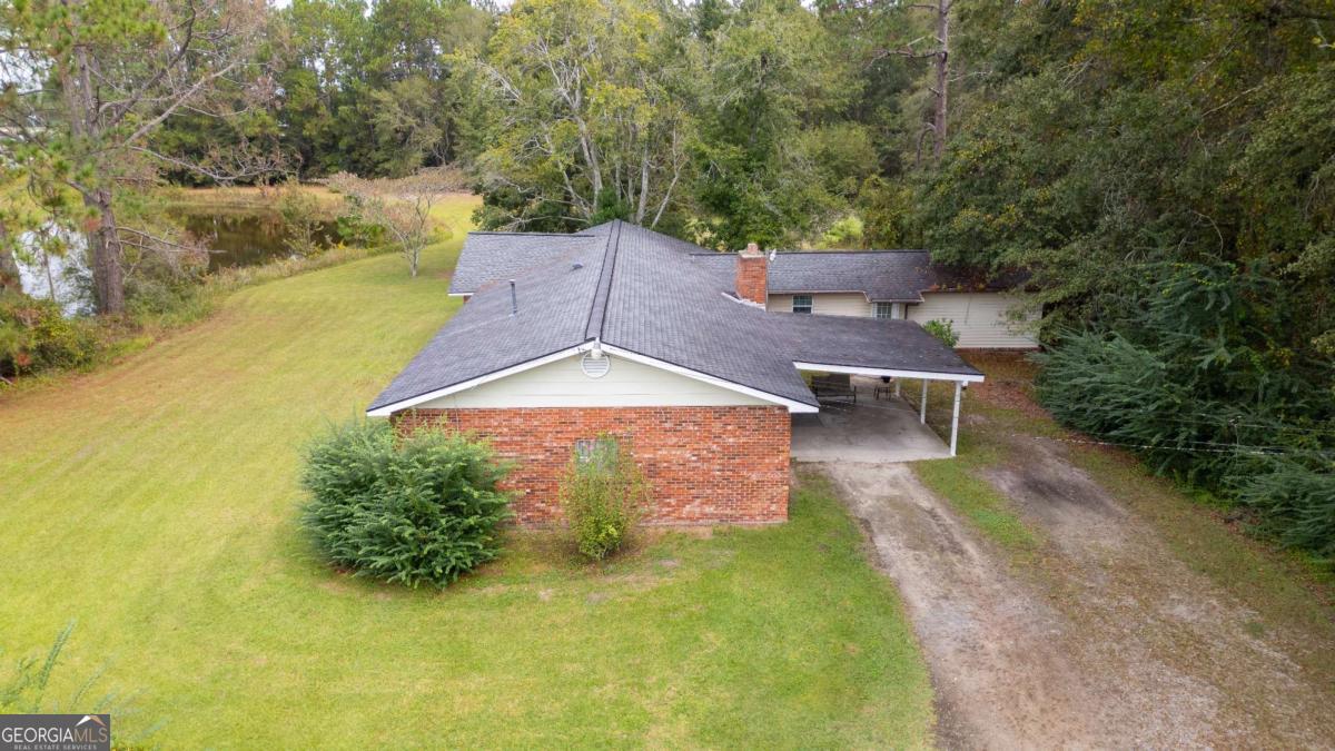 537 City Circle Road Baxley, GA 31513 - Photo 8 of 33 an aerial view of a house with swimming pool and garden