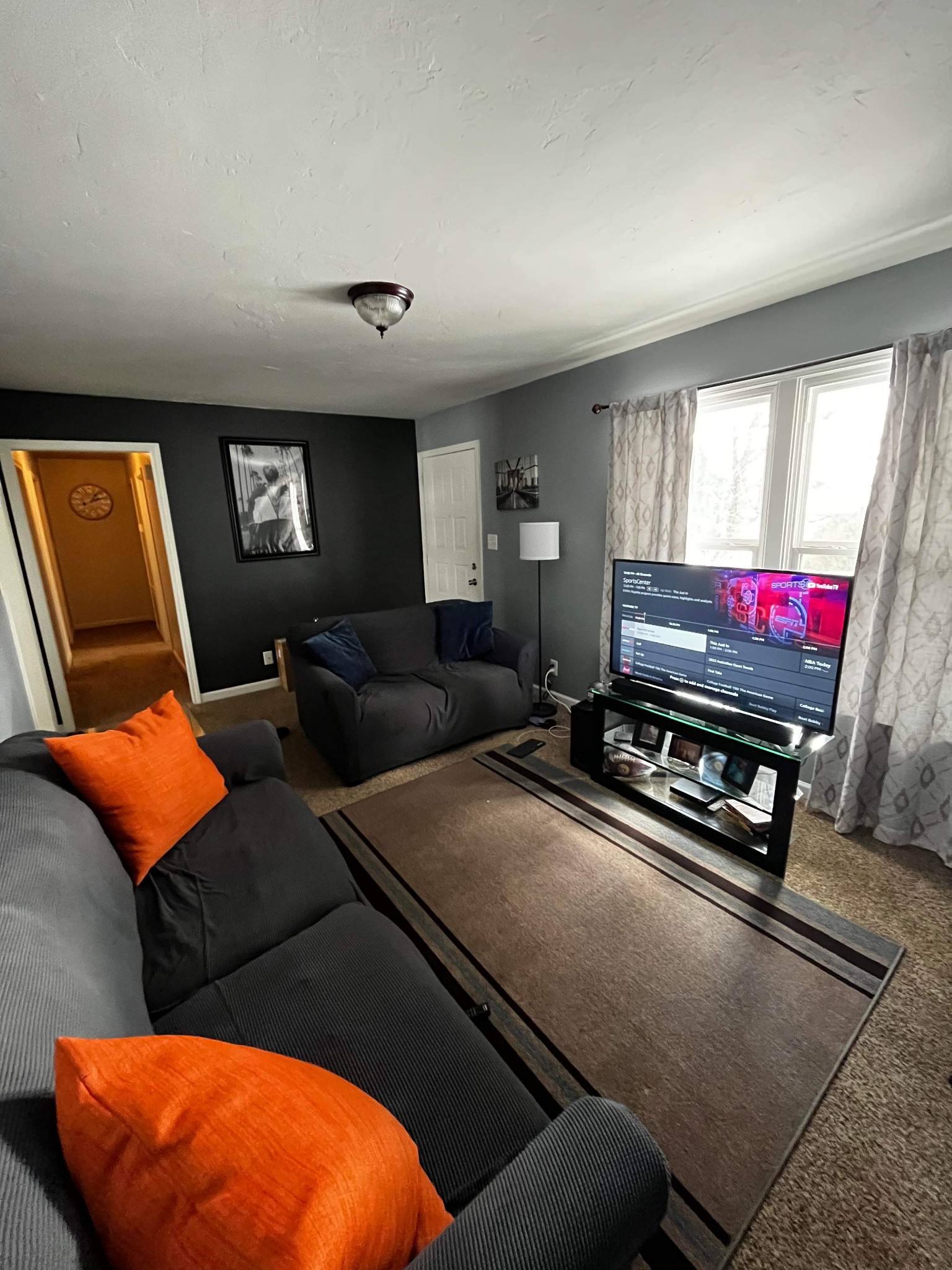 207 Quail Ridge Road Clarksville, TN 37042 - Photo 5 of 12 a living room with furniture a flat screen tv and a window