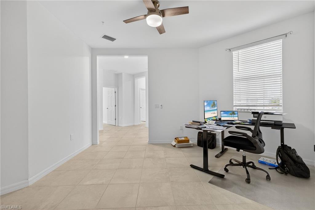 12041 Santaluz Drive, Unit 202 Fort Myers, FL 33913 - Photo 22 of 42 Office area featuring ceiling fan and light tile patterned floors