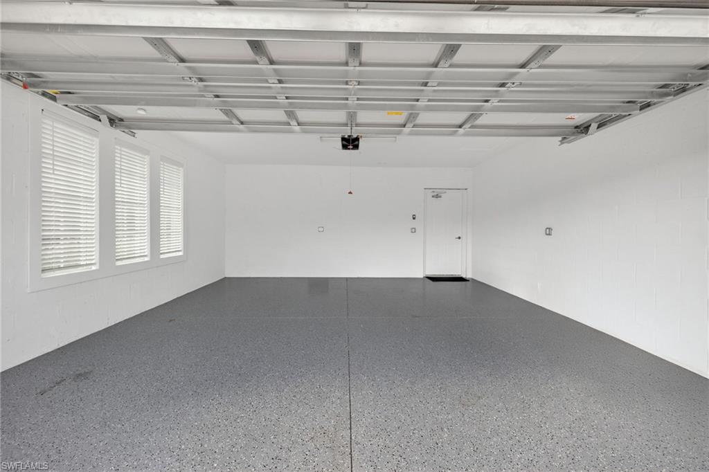 12041 Santaluz Drive, Unit 202 Fort Myers, FL 33913 - Photo 25 of 42 View of garage