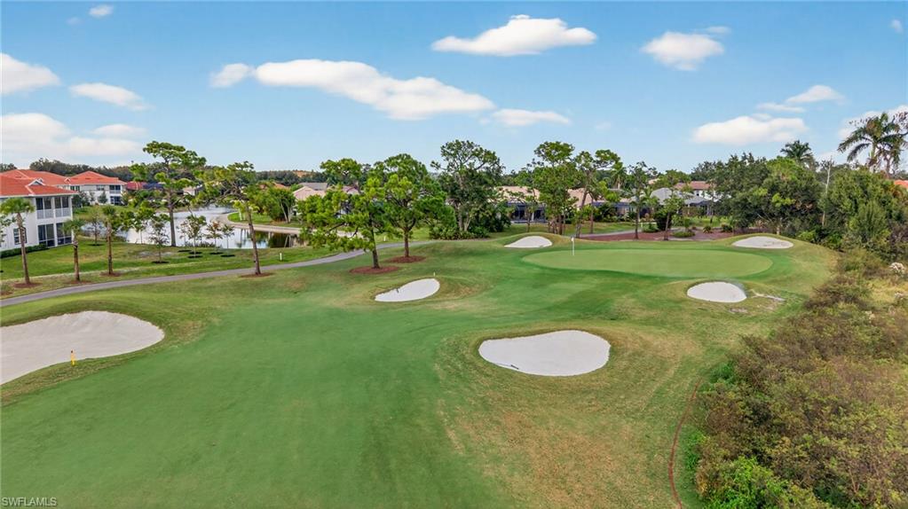 12041 Santaluz Drive, Unit 202 Fort Myers, FL 33913 - Photo 28 of 42 Surrounding community with a water view, a putting area, and golf course view