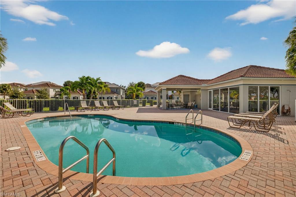 12041 Santaluz Drive, Unit 202 Fort Myers, FL 33913 - Photo 32 of 42 Community pool with a patio area