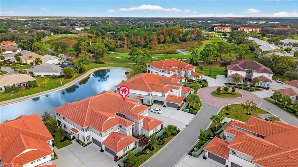 12041 Santaluz Drive, Unit 202 Fort Myers, FL 33913 - Photo 37 of 42 Aerial perspective of suburban area with a large body of water and a golf course
